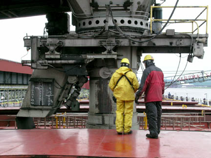 Loading spout over hatch opening